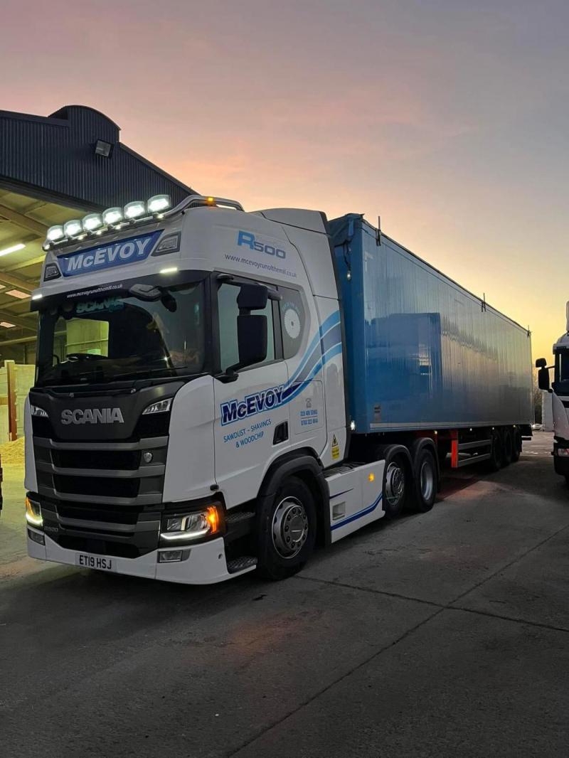 Truck with 'McEvoy' branding at sunset